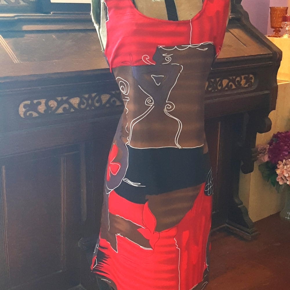 Looking Good sleeveless shift dress with self fabric tie .